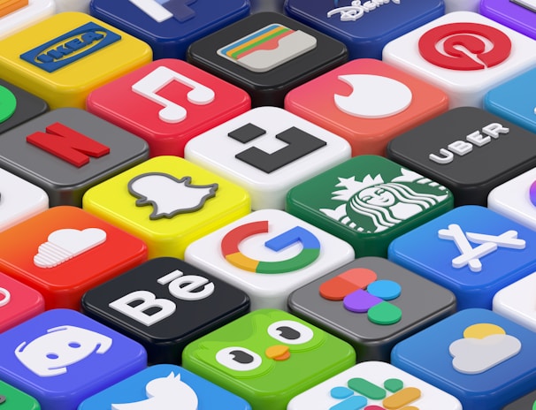 A collection of colorful 3D app icons arranged in a grid-like pattern, featuring well-known brands and services such as Spotify, Netflix, Discord, and Facebook. Each icon is distinct with vibrant colors and recognizable logos, giving a sense of modern digital culture.